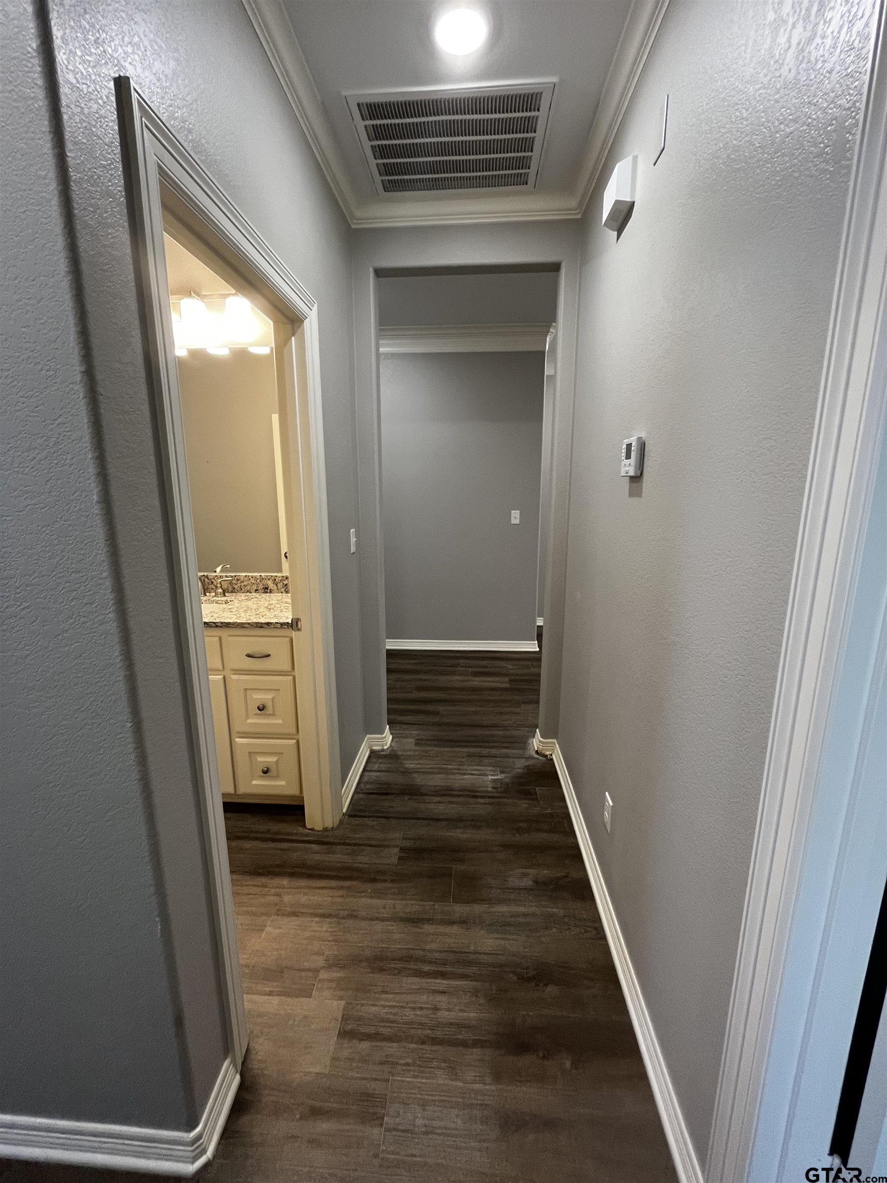 136 Letha Court Tyler, TX 75702 - Photo 23 of 34 a view of a hallway with wooden floor and entryway