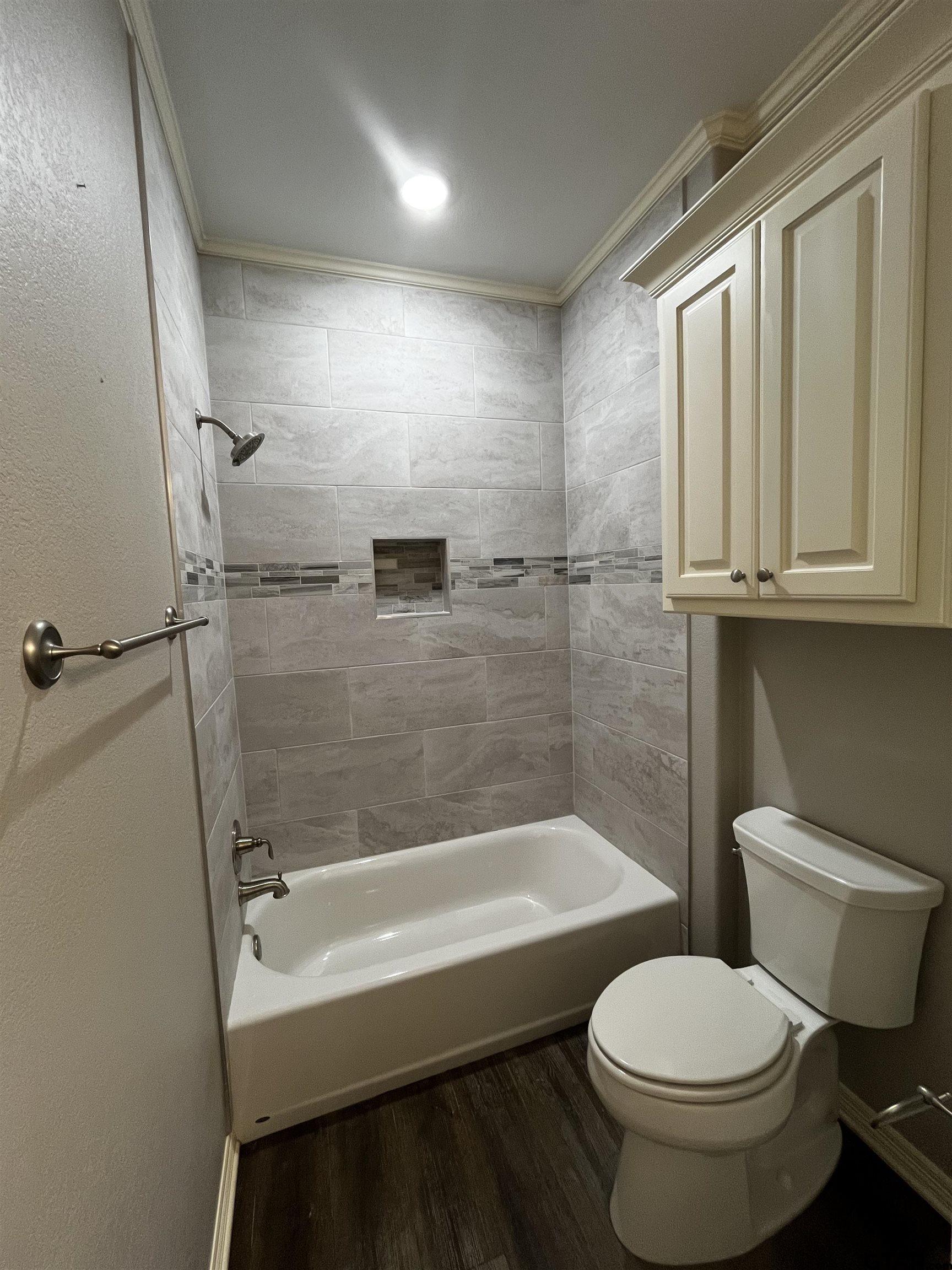 136 Letha Court Tyler, TX 75702 - Photo 26 of 34 a bathroom with a sink and a toilet
