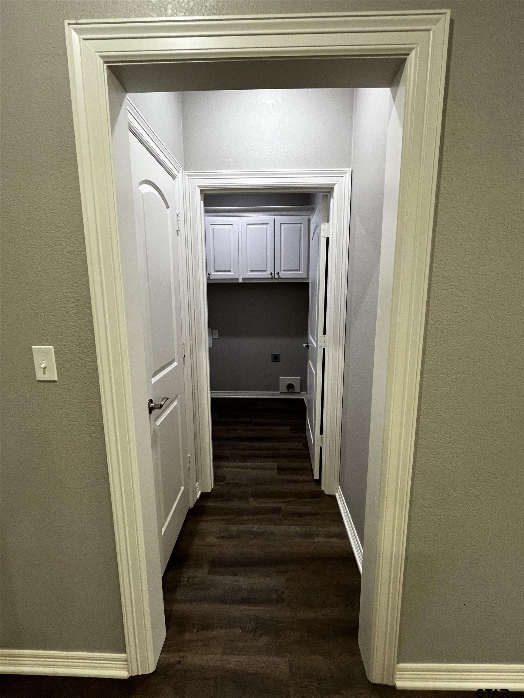 136 Letha Court Tyler, TX 75702 - Photo 27 of 34 a view of a hallway with wooden floor and staircase