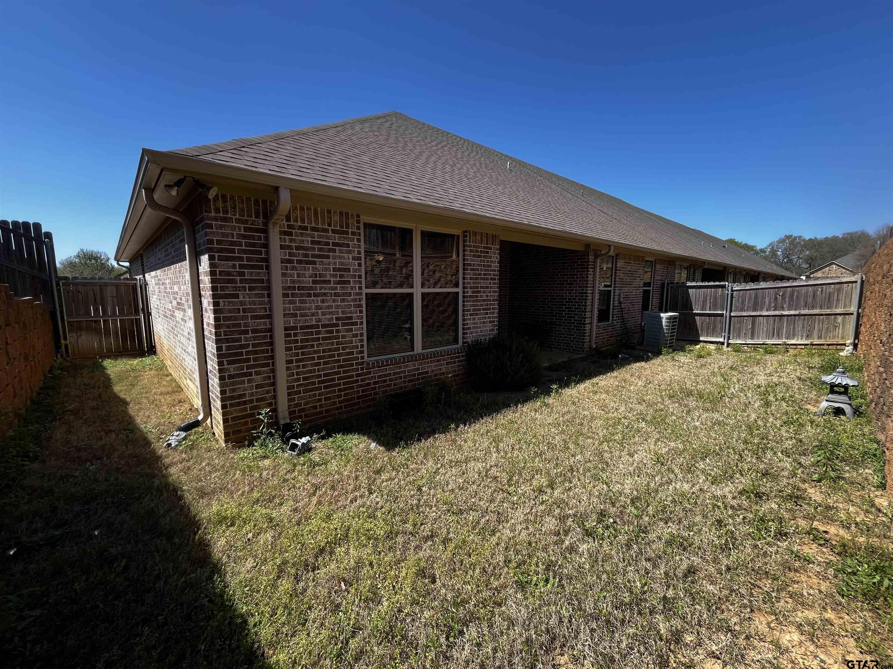 136 Letha Court Tyler, TX 75702 - Photo 30 of 34 a front view of a house with a yard
