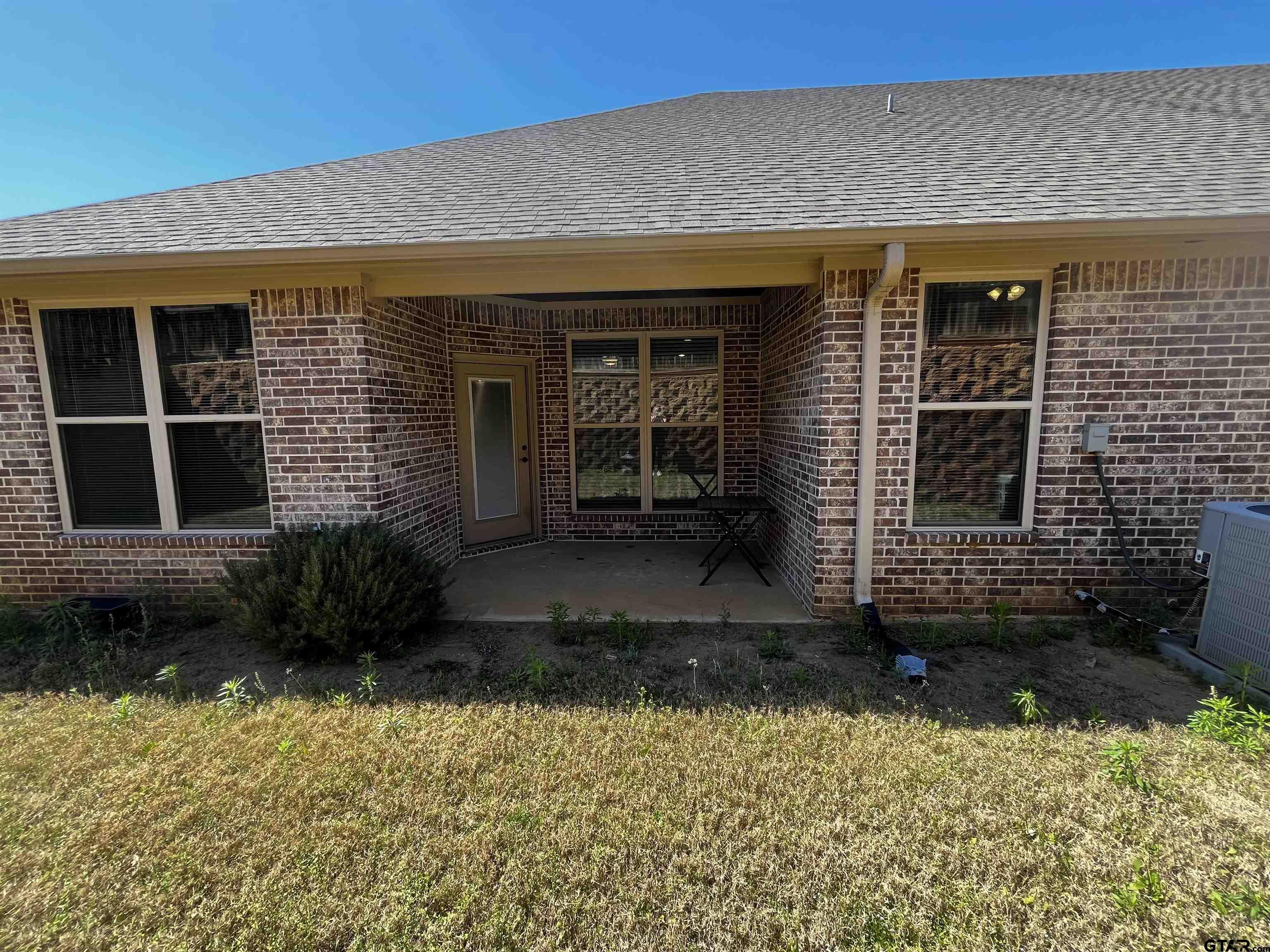 136 Letha Court Tyler, TX 75702 - Photo 31 of 34 front view of a house with a yard