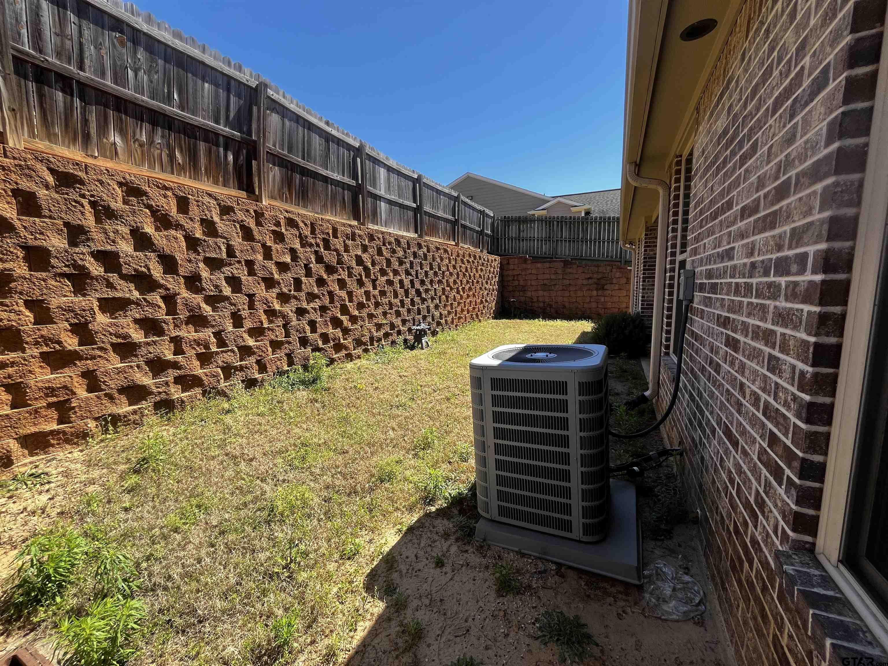 136 Letha Court Tyler, TX 75702 - Photo 33 of 34 a front view of a house with a yard