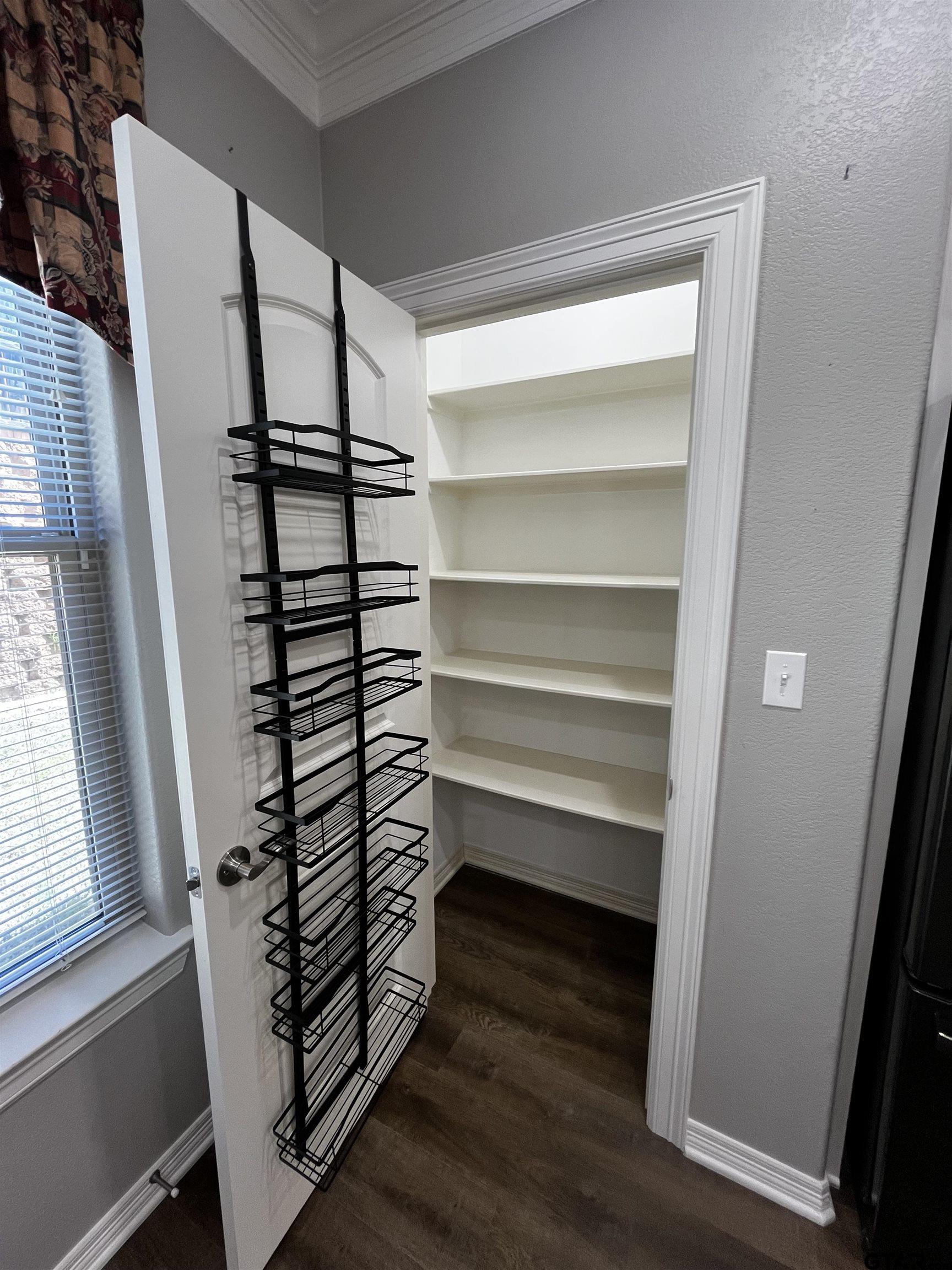 136 Letha Court Tyler, TX 75702 - Photo 8 of 34 a view of walk in closet with empty racks