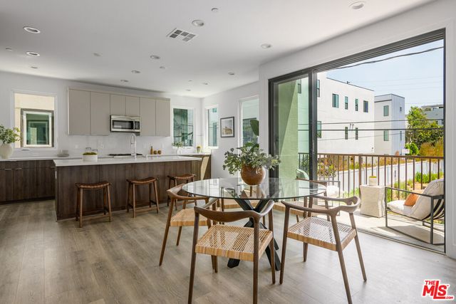 a view of a dining room with furniture and a table