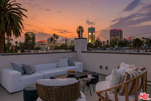 a view of a terrace with furniture