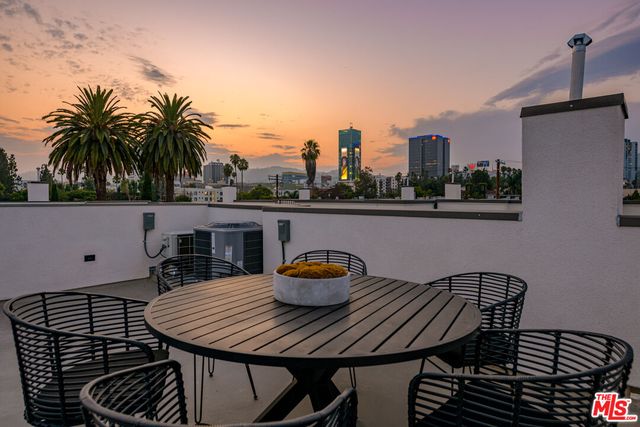 a terrace with a table and chairs