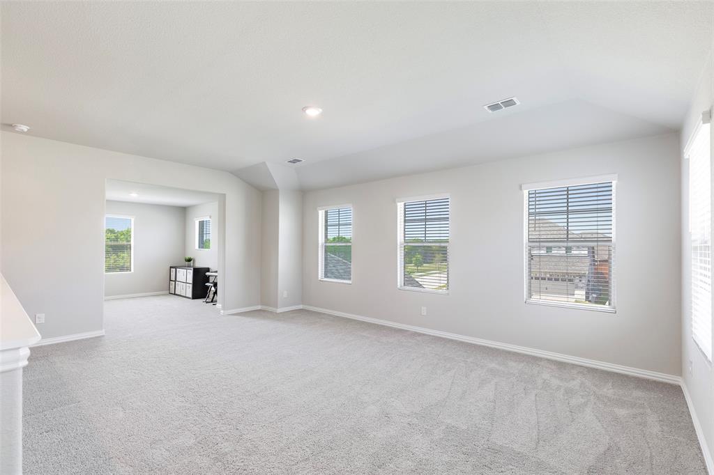 1504 Cobblestone Road Melissa, TX 75454 - Photo 23 of 39 Upstairs, the home opens into a spacious second living area designed for flexibility.Whether used as a game room, media space, or additional lounge, it offers room to truly spread out.