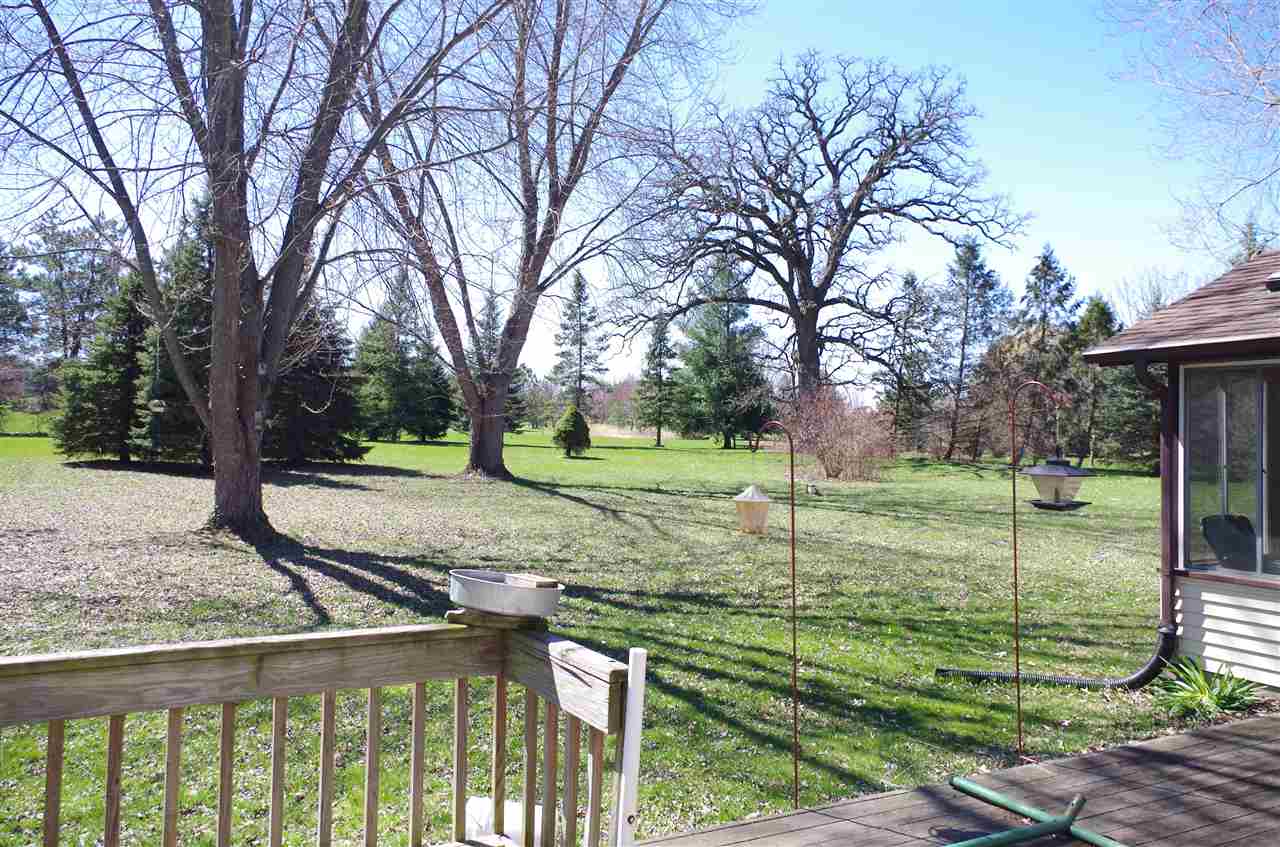 3154 Freeport Road Rockton, IL 61072 - Photo 3 of 15 a view of a backyard with tree s