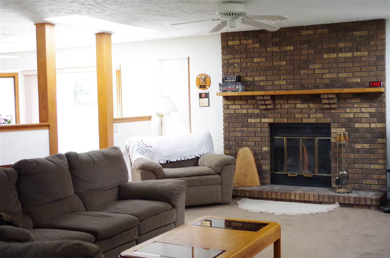 3154 Freeport Road Rockton, IL 61072 - Photo 8 of 15 a living room with furniture and a fireplace