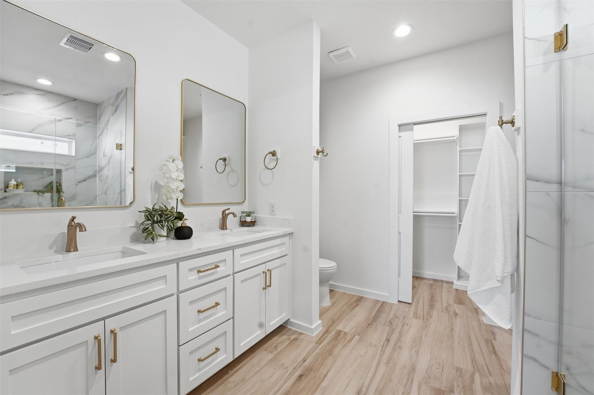 528 North 4th Street La Porte, TX 77571 - Photo 18 of 25 a bathroom with a double vanity sink and mirror