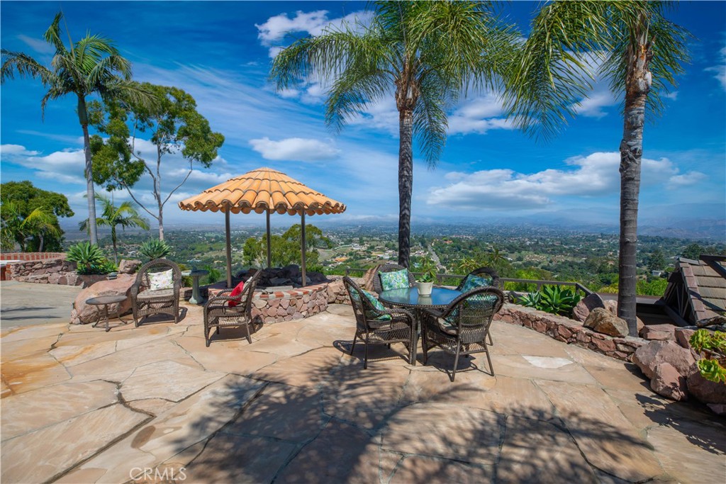 a view of a backyard with a sitting area and furniture