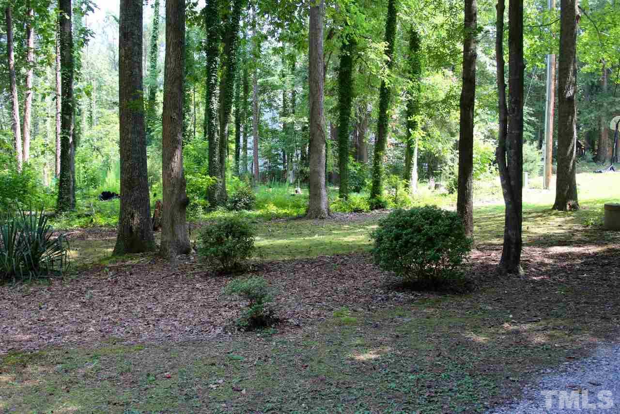 3309 Taylors Ridge Road Wake Forest, NC 27587 - Photo 12 of 17 Front yard with plenty of privacy and lots of potential for great landscaping or leaving natural for a rustic feel.