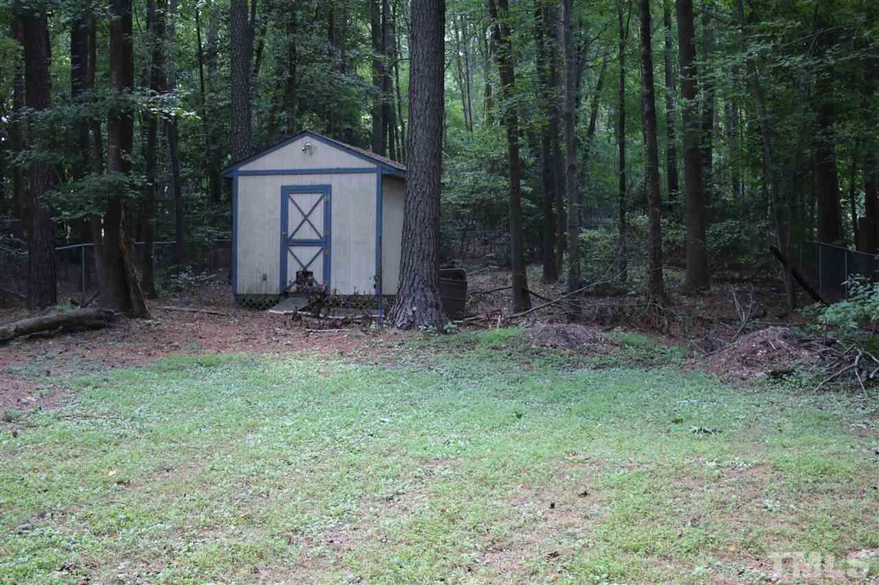 3309 Taylors Ridge Road Wake Forest, NC 27587 - Photo 15 of 17 Backyard includes lots of privacy, space, and a wired shed.