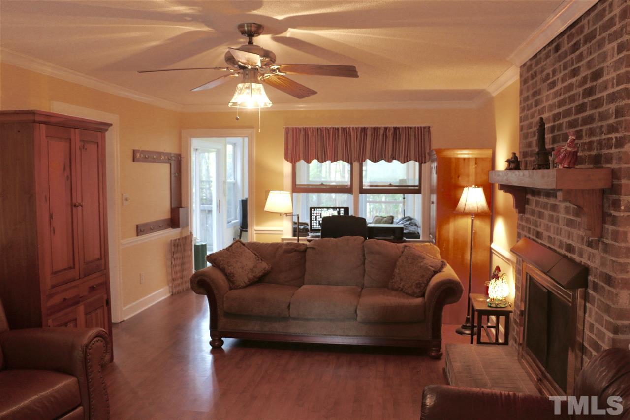 3309 Taylors Ridge Road Wake Forest, NC 27587 - Photo 3 of 17 Large room extends to porch. Fresh paint and bright. Great space!