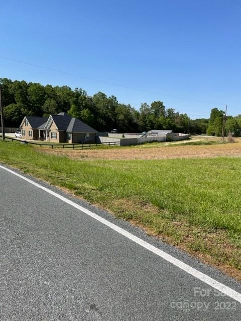 0 Rilla Hamilton Road Monroe, NC 28110 - Photo 12 of 12 a view of a house with a yard and a large tree