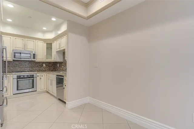 a view of an empty room with a fireplace