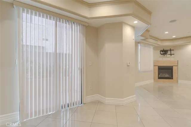 a kitchen with stainless steel appliances granite countertop white cabinets a refrigerator a sink and a stove