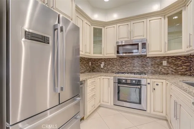 a close view of a sink and granite counter top