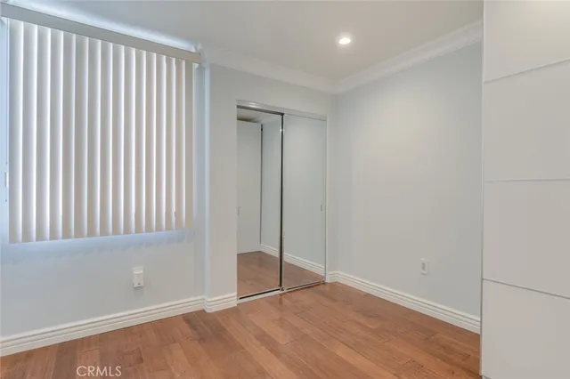 a view of staircase with white walls and a window