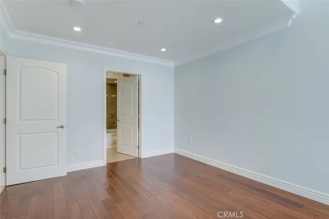 a bathroom with a granite countertop sink a mirror and a shower