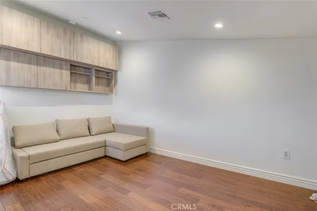 a view of a livingroom with wooden floor
