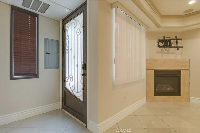 a view of an empty room with a fireplace