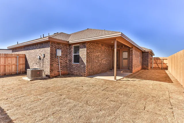 a view of a house with a snow in the yard