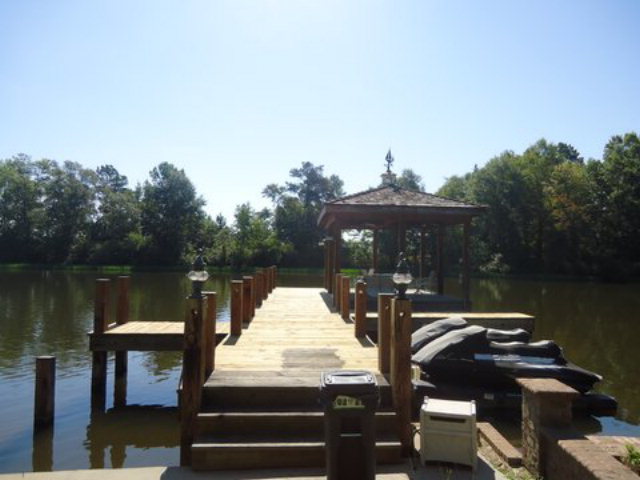 1900 Bonner Gilbert Road Macon, GA 31220 - Photo 11 of 15 a roof deck with table and chairs a barbeque