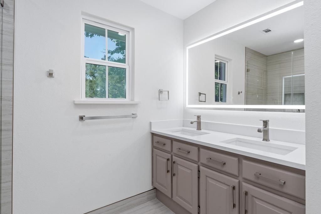 4501 Ridgeway Road Fort Worth, TX 76126 - Photo 20 of 39 a bathroom with a sink and a window