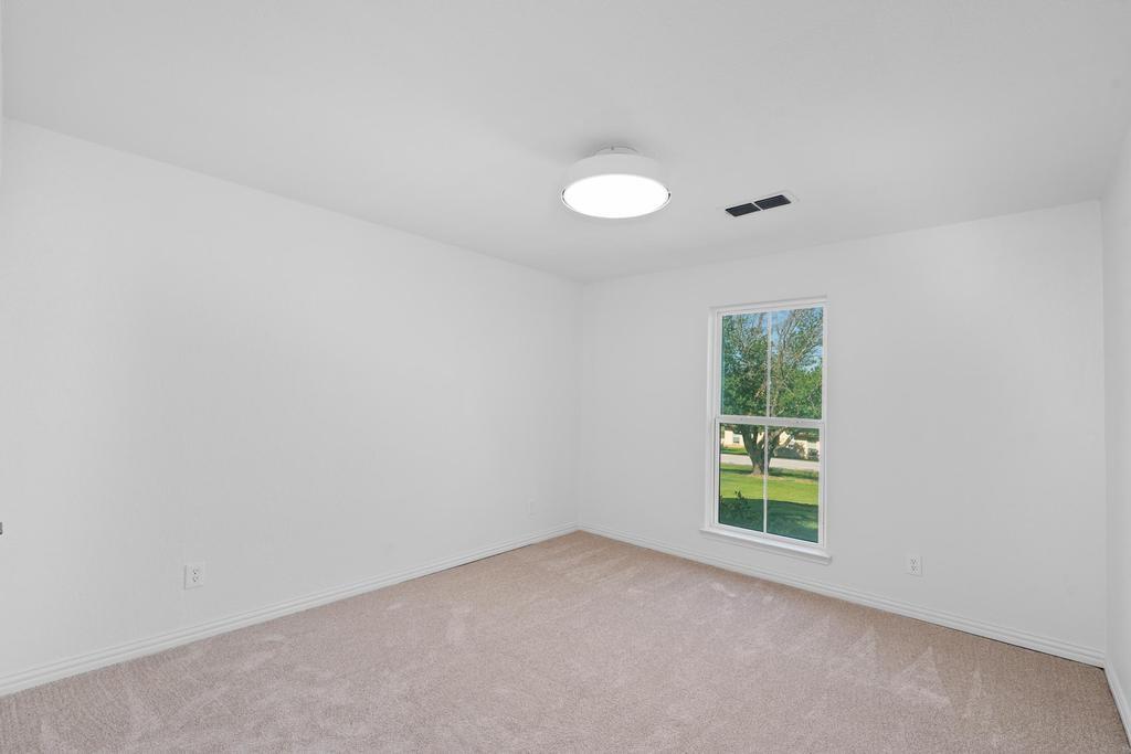 4501 Ridgeway Road Fort Worth, TX 76126 - Photo 23 of 39 an empty room with windows