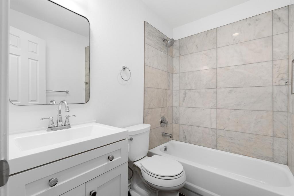 4501 Ridgeway Road Fort Worth, TX 76126 - Photo 26 of 39 a bathroom with a sink a toilet and shower