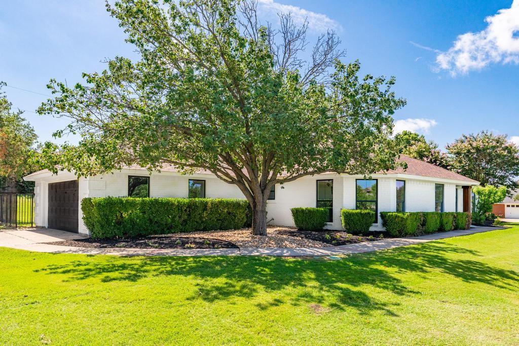 4501 Ridgeway Road Fort Worth, TX 76126 - Photo 3 of 39 a front view of a house with garden
