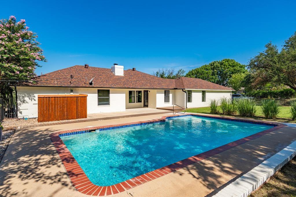 4501 Ridgeway Road Fort Worth, TX 76126 - Photo 32 of 39 a view of house with garden space and swimming pool