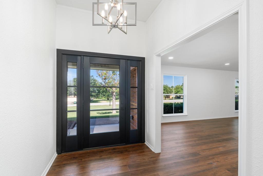 4501 Ridgeway Road Fort Worth, TX 76126 - Photo 7 of 39 a view of empty room with wooden floor and fan
