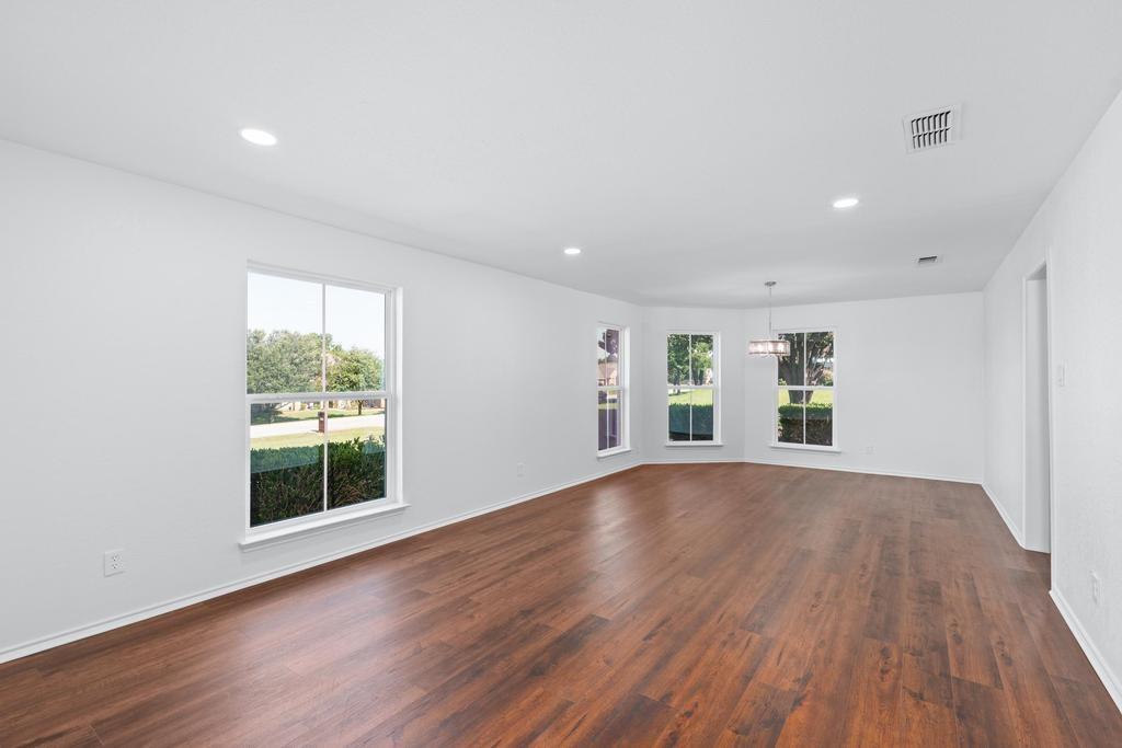 4501 Ridgeway Road Fort Worth, TX 76126 - Photo 8 of 39 a view of empty room with wooden floor and fan