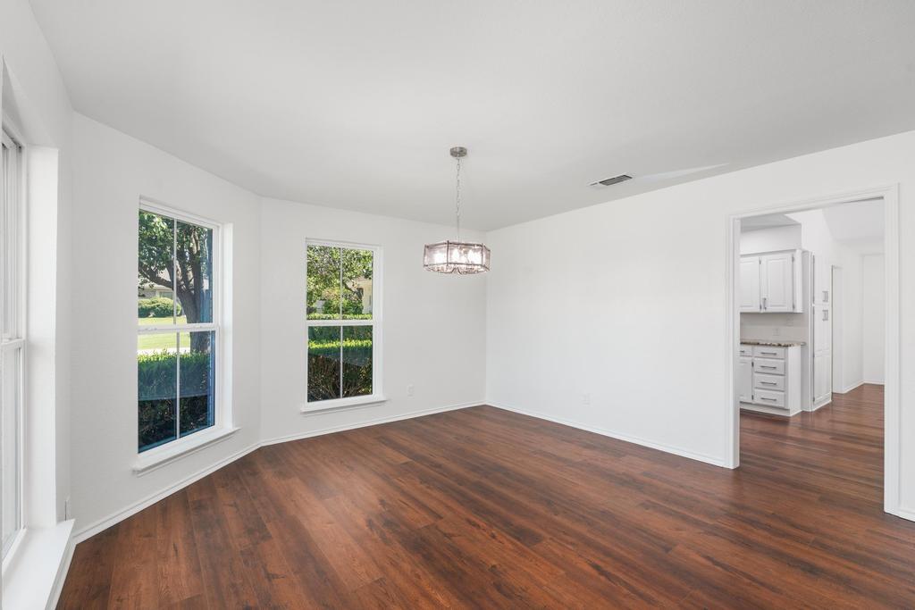 4501 Ridgeway Road Fort Worth, TX 76126 - Photo 10 of 39 a view of a room with wooden floors and windows