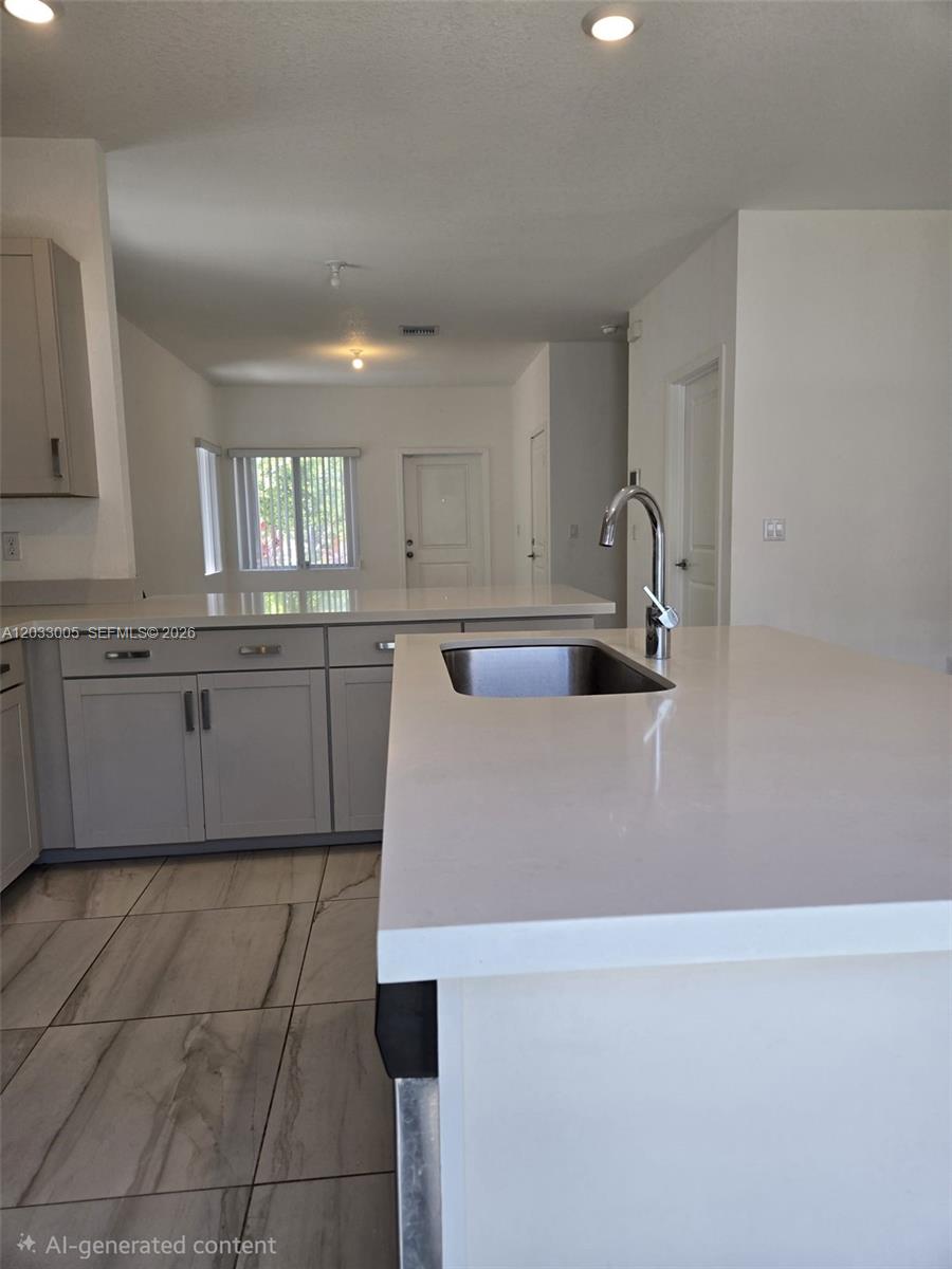 862 Southeast 17 Street, Unit 862 Homestead, FL 33034 - Photo 14 of 39 a kitchen with a sink a window and cabinets