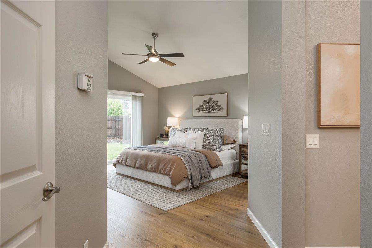 114 Kerwin Way Folsom, CA 95630 - Photo 15 of 29 a bedroom with a bed and a chandelier
