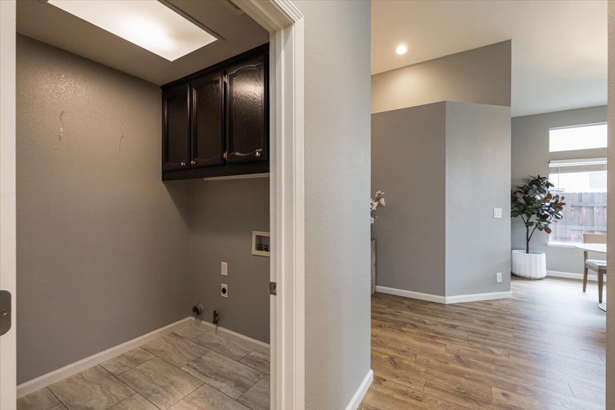 114 Kerwin Way Folsom, CA 95630 - Photo 20 of 29 a view of a hallway with wooden floor and a bathroom