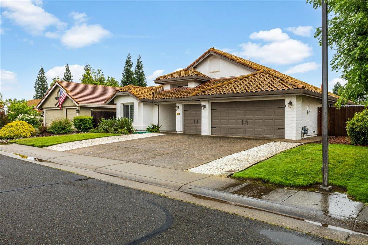 114 Kerwin Way Folsom, CA 95630 - Photo 3 of 29 a front view of a house with a garden and garage