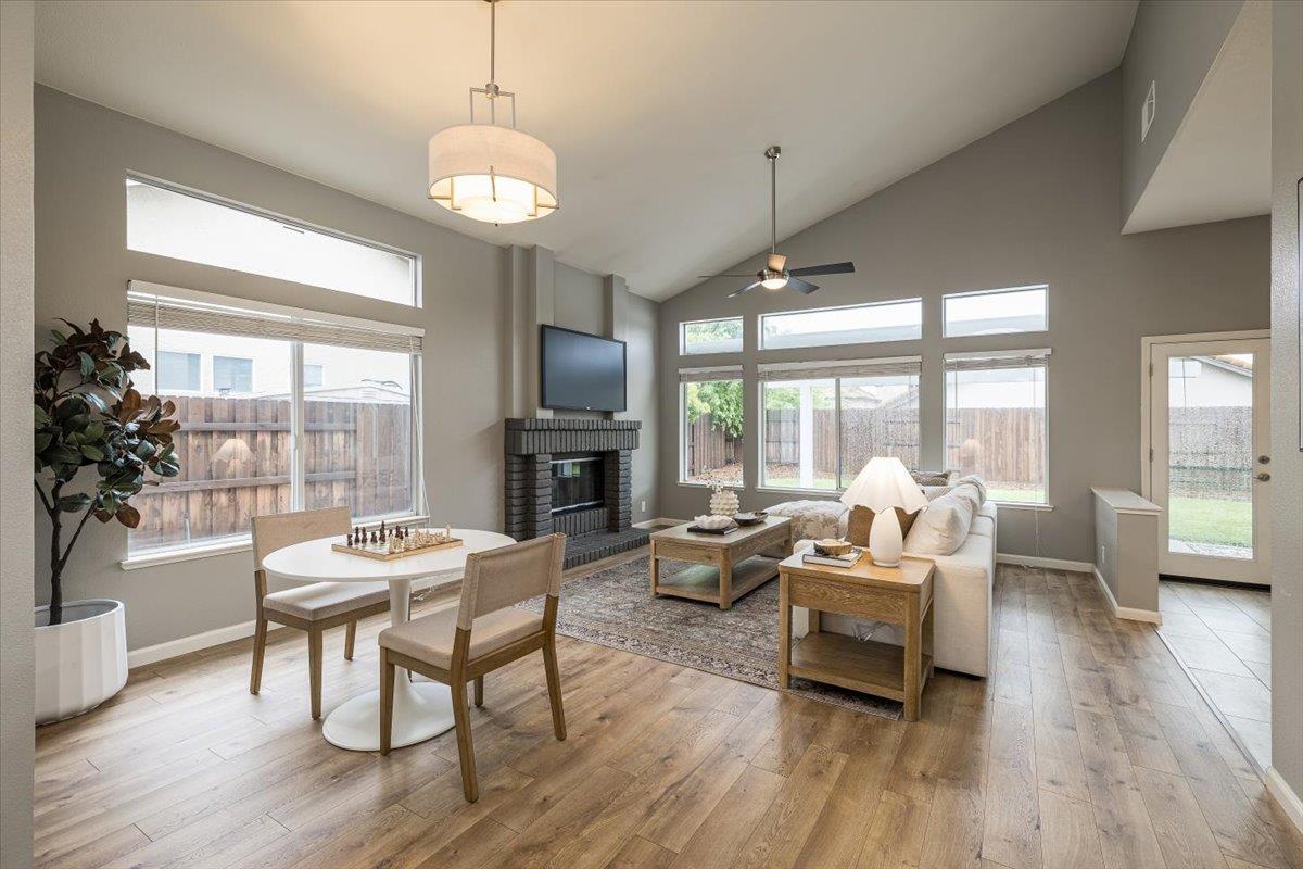114 Kerwin Way Folsom, CA 95630 - Photo 5 of 29 a living room with fireplace furniture and a large window