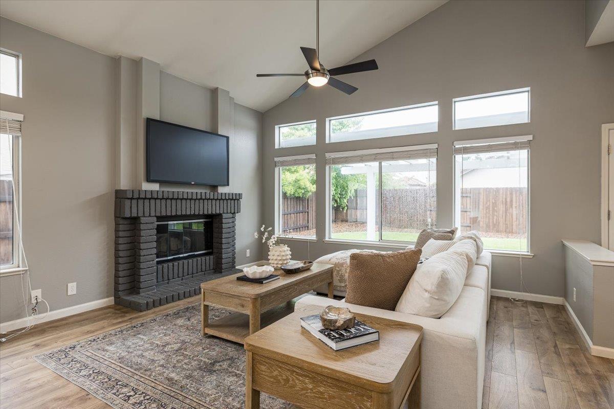 114 Kerwin Way Folsom, CA 95630 - Photo 6 of 29 a living room with furniture a fireplace and a flat screen tv