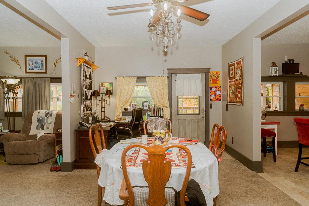 607 Main Street Emlenton, PA 16373 - Photo 17 of 62 a bed room with a bed and a chandelier