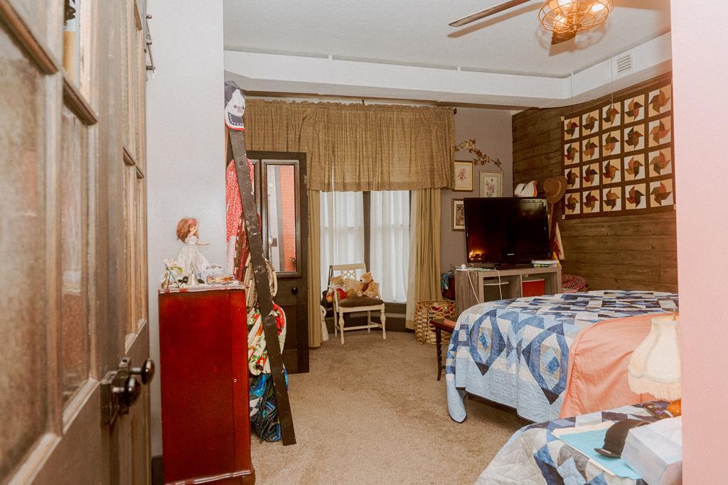 607 Main Street Emlenton, PA 16373 - Photo 24 of 62 a bedroom with furniture and a flat screen tv