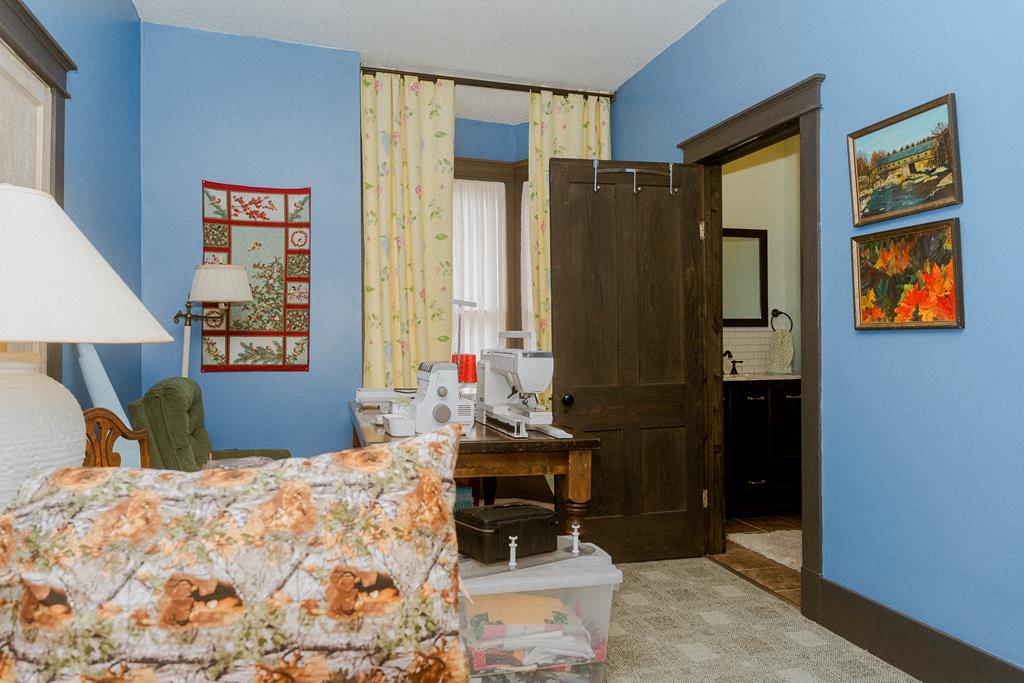 607 Main Street Emlenton, PA 16373 - Photo 29 of 62 a bedroom with a bed and wooden cabinets