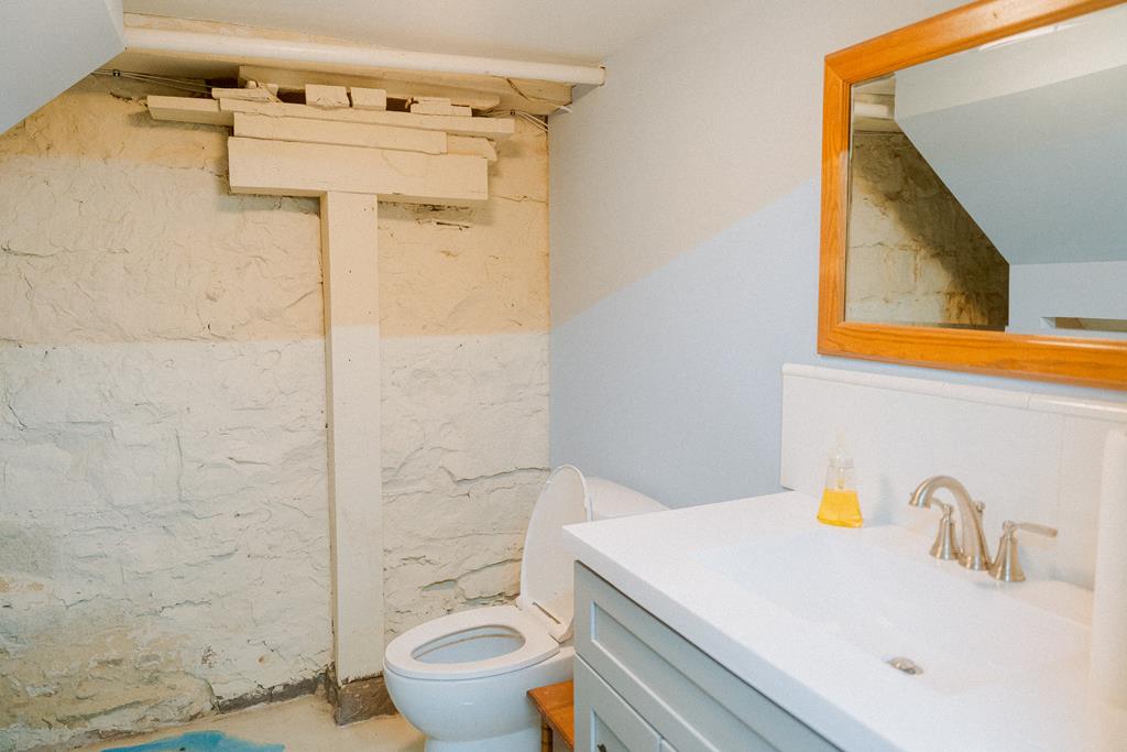 607 Main Street Emlenton, PA 16373 - Photo 45 of 62 a bathroom with a sink a toilet and shower