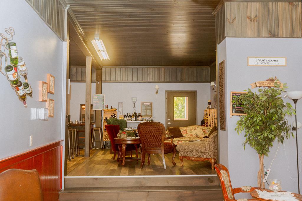 607 Main Street Emlenton, PA 16373 - Photo 49 of 62 a view of a dining room with furniture and a potted plant