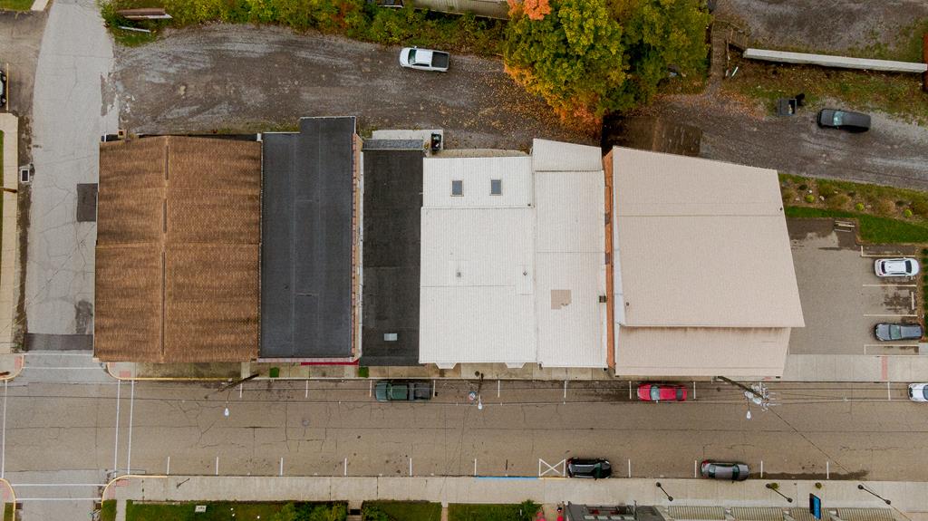 607 Main Street Emlenton, PA 16373 - Photo 5 of 62 an aerial view of a house with a yard and garage