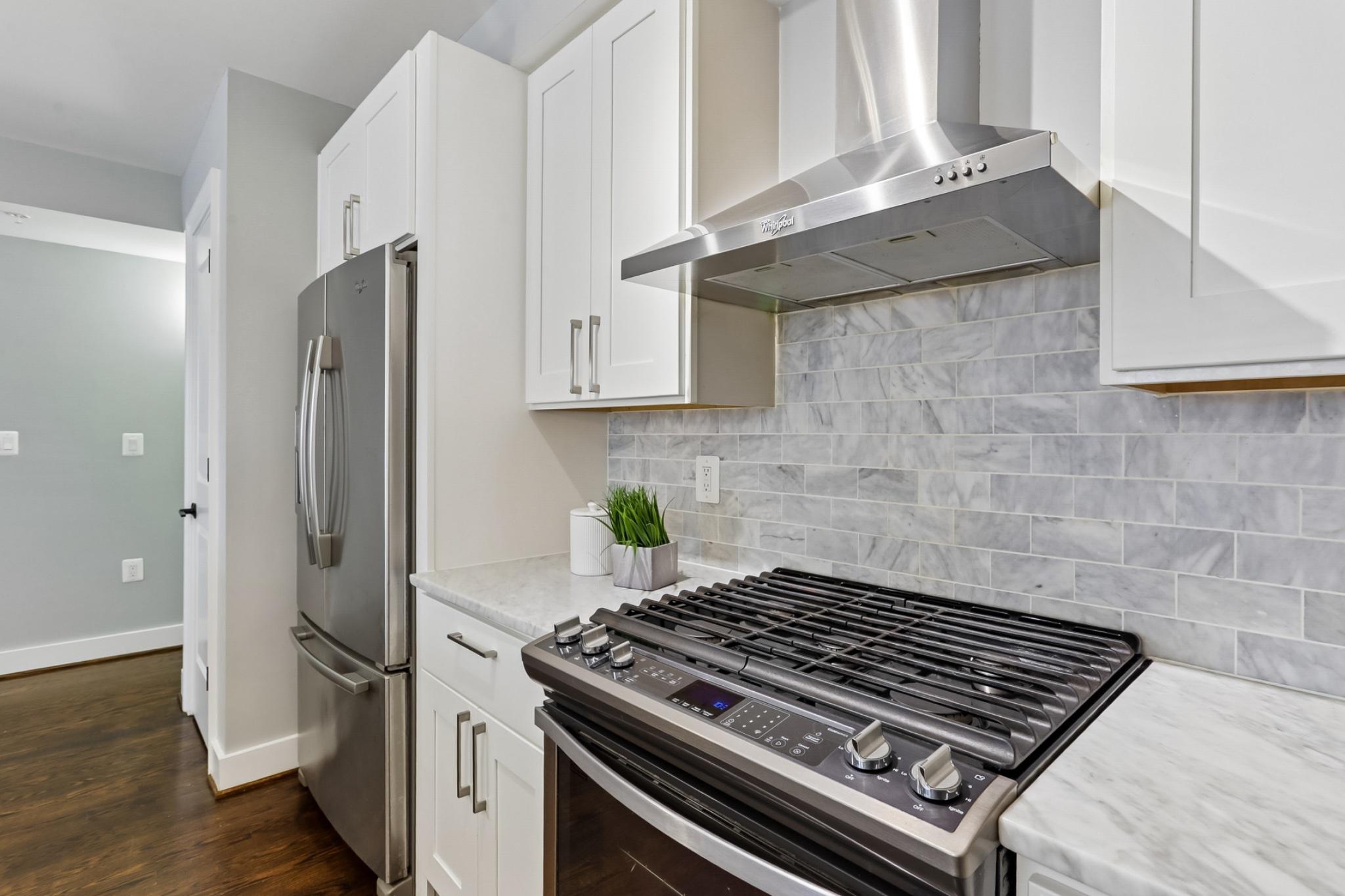 1311 K Street Southeast, Unit 1 Washington, DC 20003 - Photo 8 of 33 Chef's kitchen with gas range.