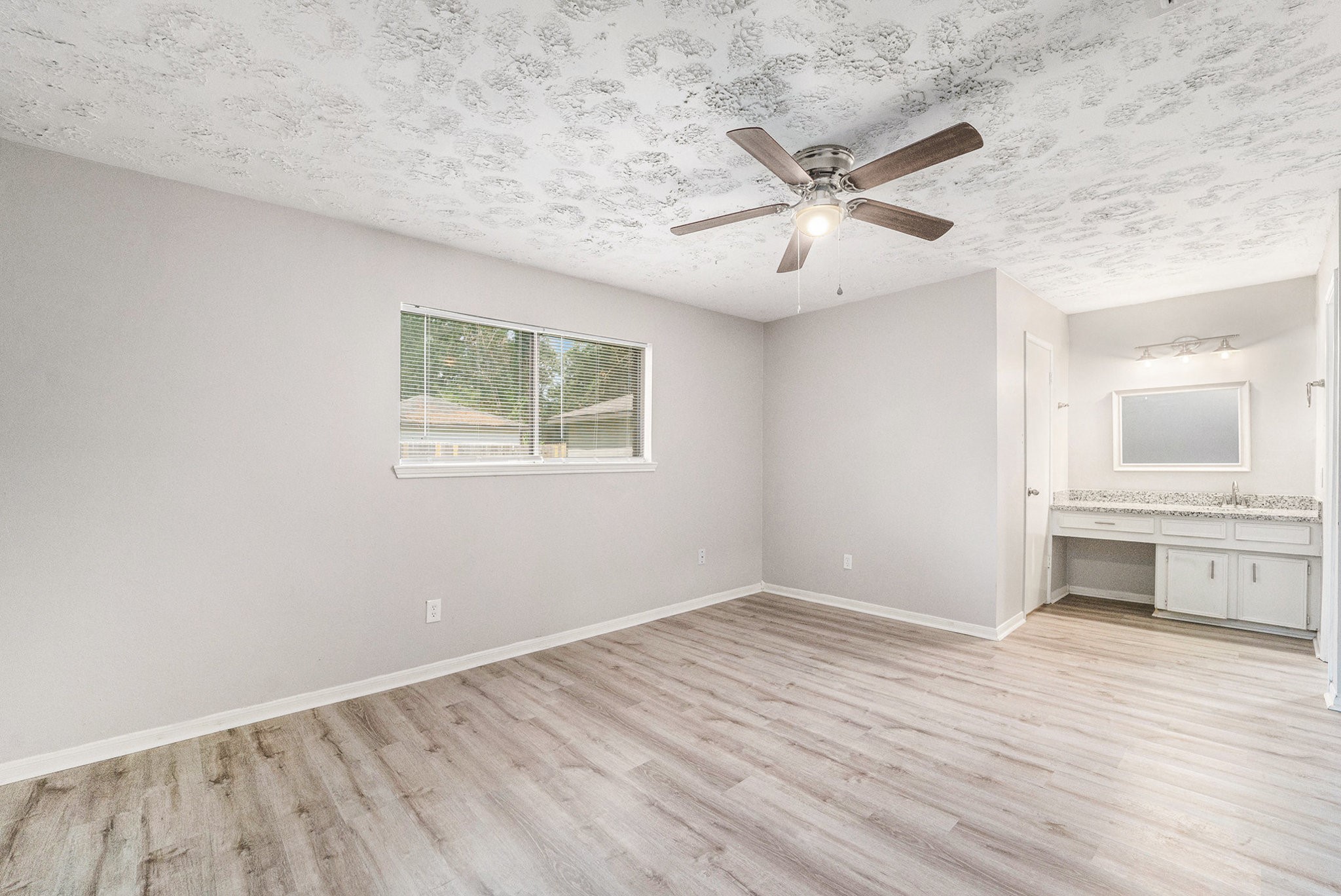 23235 Earlmist Drive Spring, TX 77373 - Photo 14 of 33 wooden floor in an empty room with a window